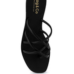 Women's handcrafted black crisscross flat sandals with minimalist strappy design by Rag & Co – stylish slip-on summer footwear.