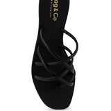 Women's handcrafted black crisscross flat sandals with minimalist strappy design by Rag & Co – stylish slip-on summer footwear.