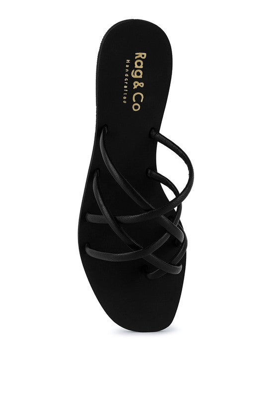 Women's handcrafted black crisscross flat sandals with minimalist strappy design by Rag & Co – stylish slip-on summer footwear.