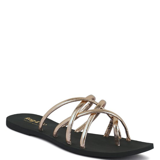 Women's handcrafted gold crisscross flat sandals with minimalist strappy design by Rag & Co – stylish slip-on summer footwear.