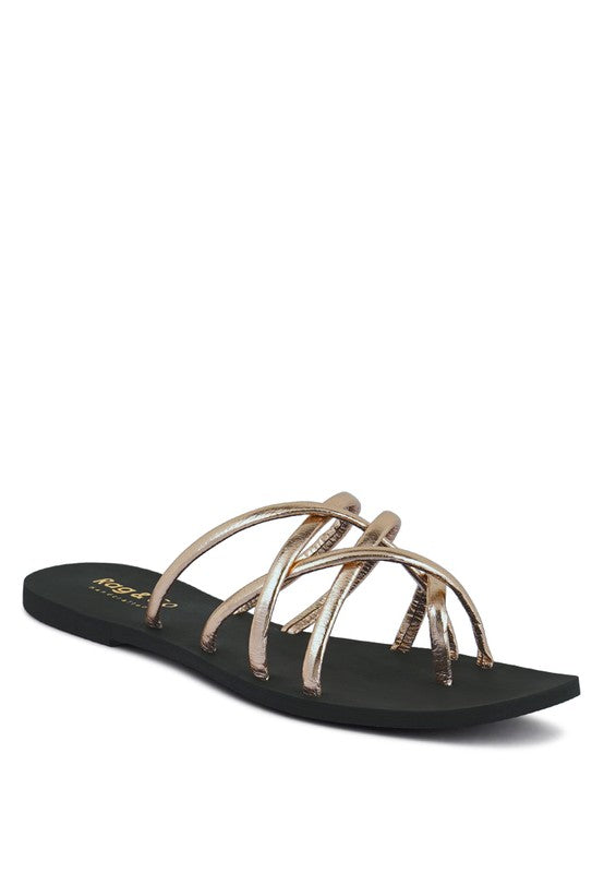 Women's handcrafted gold crisscross flat sandals with minimalist strappy design by Rag & Co – stylish slip-on summer footwear.