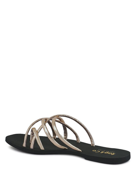 Women's handcrafted gold crisscross flat sandals with minimalist strappy design by Rag & Co – stylish slip-on summer footwear.