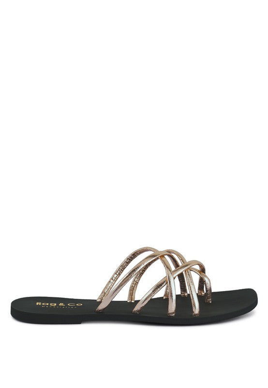 Women's handcrafted gold crisscross flat sandals with minimalist strappy design by Rag & Co – stylish slip-on summer footwear.