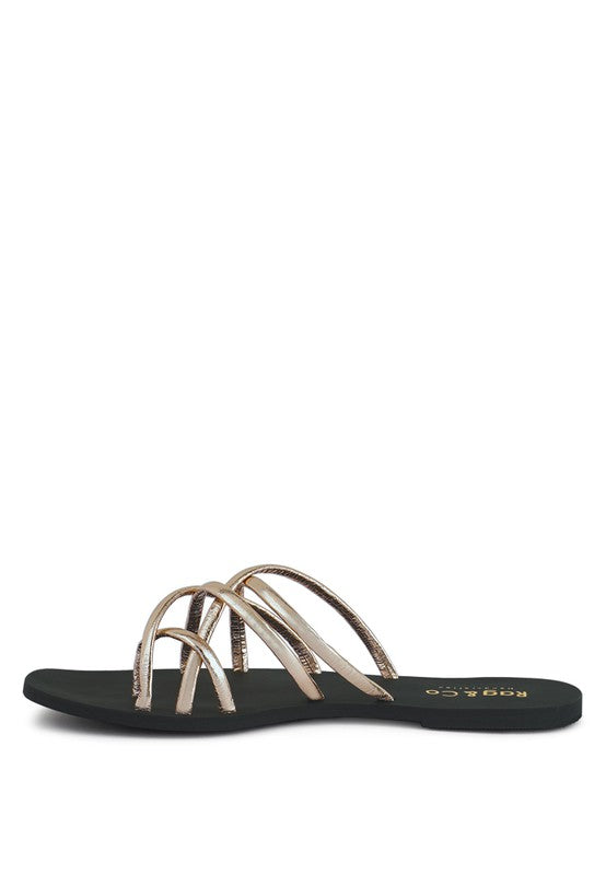 Women's handcrafted gold crisscross flat sandals with minimalist strappy design by Rag & Co – stylish slip-on summer footwear.