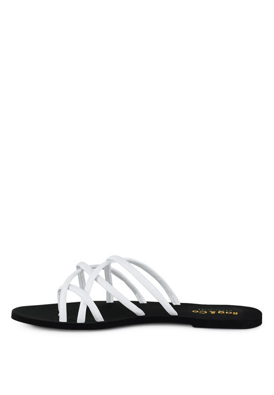 Women's handcrafted White crisscross flat sandals with minimalist strappy design by Rag & Co – stylish slip-on summer footwear.
