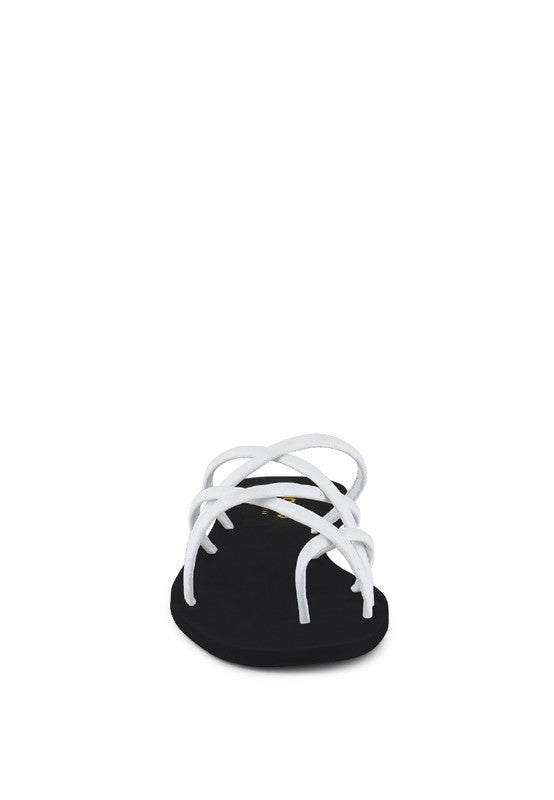 Women's handcrafted White crisscross flat sandals with minimalist strappy design by Rag & Co – stylish slip-on summer footwear.