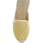Backless women’s espadrille mule with woven raffia upper and jute sole, shown in yellow, black, and natural beige color options.